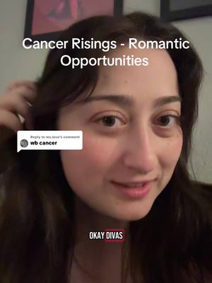 A woman with long, dark hair holds near it with her hand, looking towards the camera. The overlay text shows 'Cancer Risings - Romantic Opportunities' at the top and a comment bubble on the bottom left.