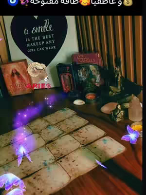 The image showcases a dark, mystical scene with a table setting that includes tarot cards, books, crystals and a wooden table as a base. A 'Aries' sign can be seen. The color scheme is moody, hinting at the content related to the astrological theme.