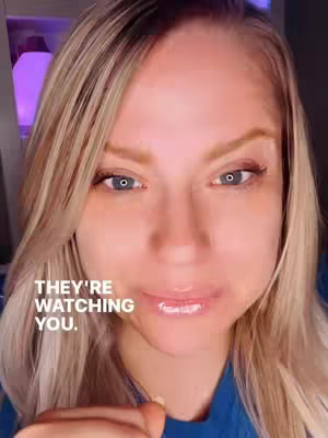 A close-up of a woman's face with blonde hair and blue eyes, set against a blurred background. Text overlays the image.