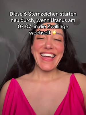 A woman with long dark hair is smiling broadly, her mouth wide open, showing her teeth. She's wearing a bright pink dress. Text overlays are at the top.