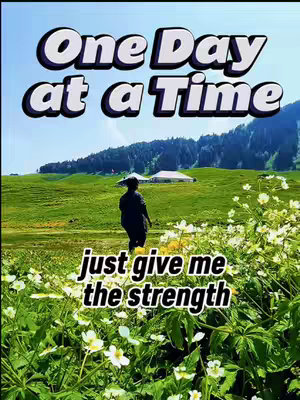 The cover image shows a scenic view with a backdrop of mountains, green fields, and a blue sky. Text overlays read: "One Day at a Time," and "just give me the strength."
