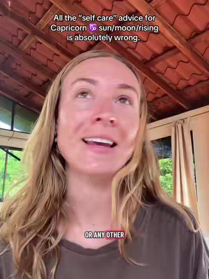 A woman with long, light brown hair is looking upward, with text overlaid near her head and in the bottom of the frame. The background features a wooden structure, and a window is visible on the side, suggesting an outdoor setting.