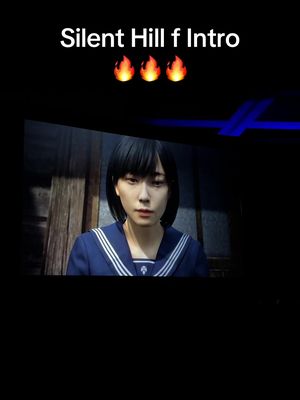 The image is a vertical video frame featuring a young woman in a school uniform. The woman has black hair and a serious expression. Above her, the text "Silent Hill f Intro" is displayed in a white font, alongside three flame emojis. The background is a dimly lit, textured space with what appears to be wooden paneling. The overall composition is dark and creates a sense of mystery.