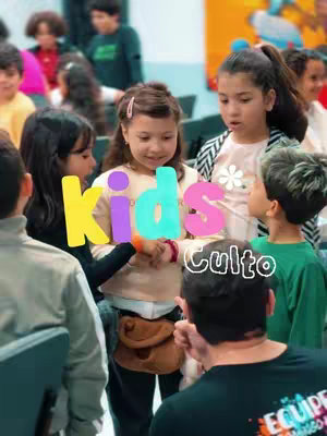 Image shows a group of children surrounding three words: kids, culto, with a background that is blurry.