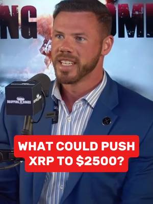 A man in a blue suit is speaking into a microphone. Colored text overlay reads "WHAT COULD PUSH XRP TO $2500?". The background contains a blurred visual.