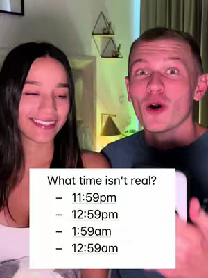 The cover photo is a split screen featuring two people in a room setting. On the left is a woman with long dark hair smiling and looking to her left. Next to her, on the right side of the screen, is a man. He has short blonde hair and a surprised expression, looking directly at the camera with his mouth open. In the center is a block of text with a question and multiple-choice answers. The background hints at a home setting with warm lighting and some decorative items.