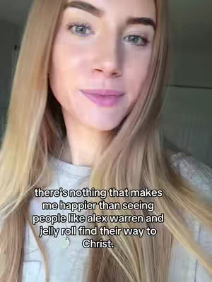 A young woman with long blonde hair is centered in a selfie-style video. She is smiling slightly, and the background is blurred, showing a glimpse of a room. Text overlayed on the image reads a positive message about finding one's way to Christ.