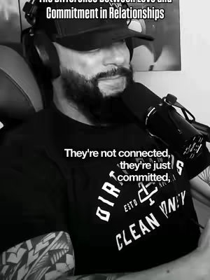 A grayscale image features a person with a beard wearing a black t-shirt and baseball cap, holding a microphone. Text overlays are added to the image.