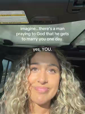 A selfie taken from inside a vehicle, showcasing a woman with curly blonde hair. The text overlay reads, 'imagine...there's a man praying to God that he gets to marry you one day. yes, YOU.' The woman looks directly at the camera with a slight smile, set against the backdrop of the vehicle's interior.