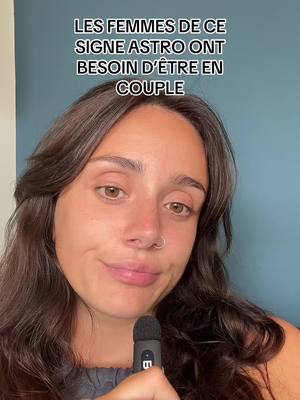 A selfie-style video cover image featuring a young woman with brown hair, a nose ring, and a microphone in her hand. Text overlay indicates the video's astrological topic.