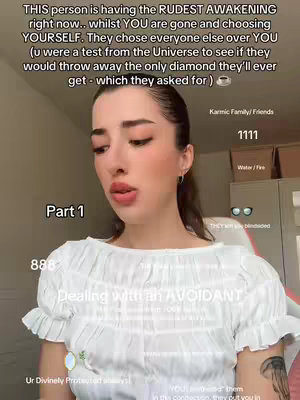 A young woman with dark hair and makeup looks directly at the camera. Text overlays describe a spiritual theme. The background is a room with white walls and a glimpse of a white chair, suggesting an indoor setting.