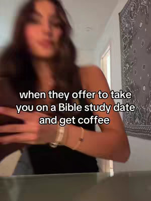The cover image shows a young woman slightly out of focus, holding a phone and looking off towards the left. Text overlayed on the image states 'when they offer to take you on a Bible study date and get coffee.' The background suggests a domestic setting, with a decorative wall hanging adding visual interest. The overall composition is casual and captures a moment of potential excitement of the subject.