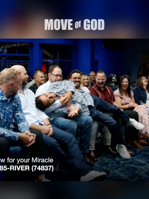 The image shows a group of people in an indoor setting, likely a church or auditorium, with a focus on expressions of religious experience. Above the group are the words 'MOVE OF GOD' in white text. The people are of various ages and ethnicities and are seated on benches. One man is being supported by another in a position that suggests a spiritual experience. A woman in the front row is laughing. The background is out of focus with some blue lighting.