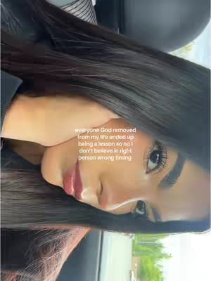 The cover image displays a young woman with long dark hair, positioned at an angle. She's looking towards the right side of the frame. The background is soft focus but suggests she is inside a vehicle and wearing a black top. Written on top of the image is a text overlay.