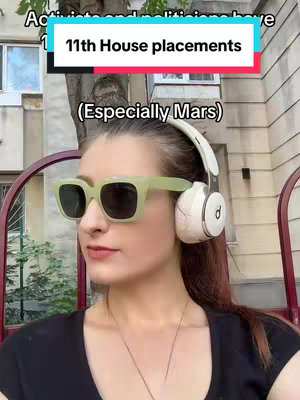 A woman wearing light green sunglasses and white headphones sits outside. The background includes trees and a building. Text overlays state "Activists and politicians have 11th House placements" and "(Especially Mars)".