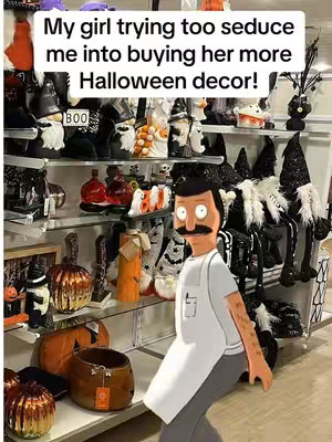 A cover image features a display of Halloween decorations in beige and black colors, with a cartoon character cutout in the foreground angled in the lower right corner.