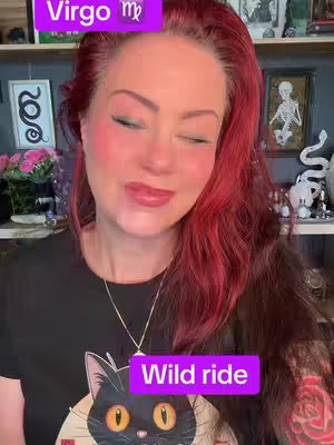 The cover image features a woman with red hair and fair skin. She is wearing a black t-shirt with a graphic of a black cat. The background displays a room with artwork and decor. Text overlays indicating the astrological sign "Virgo" and the phrase "Wild ride" are present.