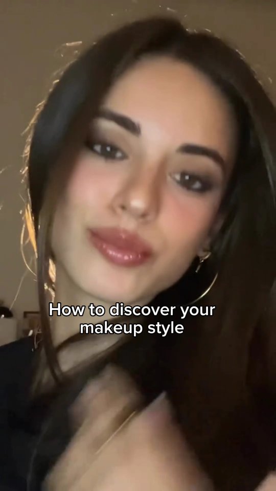 A close-up shot of a woman with brown hair and makeup framing her face. Text at the bottom reads, How to discover your makeup style.
