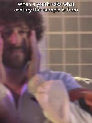 The cover image features a blurry, close-up shot of a man with curly hair clutching his head. The background appears to be warm-toned and out of focus. Overlayed text states, "When a youth asks what century this sample is from."
