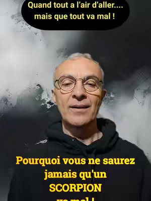 A man in glasses and a black hoodie looks directly at the camera, set against a blurry, gray background. Text overlays in white and yellow are placed above and below his image.
