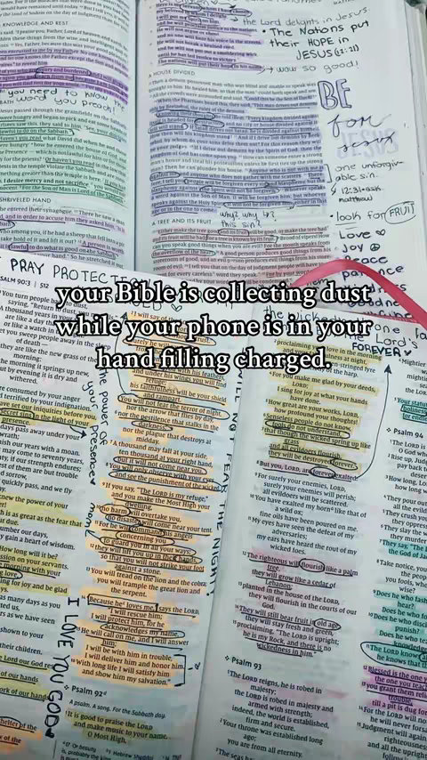 The image shows an open Bible with highlighted passages and handwritten annotations. A bold text overlay states, 'Your Bible is collecting dust while your phone is in your hand, filling charged.' The background shows the Bible's pages, filled with text, highlighting, and handwritten notes. The overall composition is a juxtaposition of religious context with a modern technological contrast.