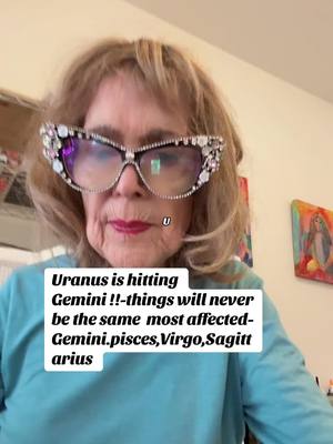 An older woman with blonde hair is wearing large, bedazzled glasses and red lipstick. Text overlays are present at the bottom of the image.