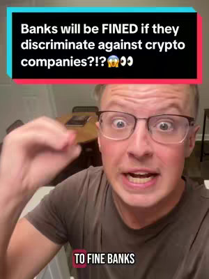 A man with glasses is speaking animatedly, with text overlays describing the video's subject, including the phrase "Banks will be FINED if they discriminate against crypto companies?!"