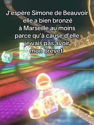 The image is a screenshot from a racing game, such as Mario Kart, with a colorful rainbow track. The primary visual element is a character, likely a game figure, rendered in a semi-transparent, glowing style as if they are speeding in a race. Text overlays are visible at the top of the image, written in a cursive font.