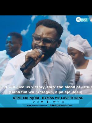 A cover image featuring a male singer center stage, holding a microphone and passionately singing. Two other individuals are slightly blurred in the background, also appearing to sing. The background consists of a soft blue color. The image has overlaid text with the song's lyrics at the bottom.