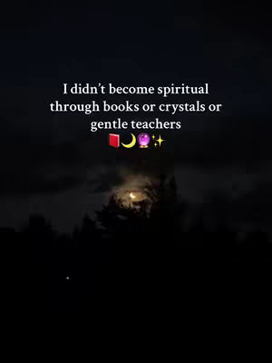The cover image is set against a dark night sky backdrop, with what appears to be a moon shining through. Above the moon and some trees/silhouette is overlaid text in white. The text reads: 'I didn't become spiritual through books or crystals or gentle teachers,' and then below three emojis. The overall composition is simple and somber.