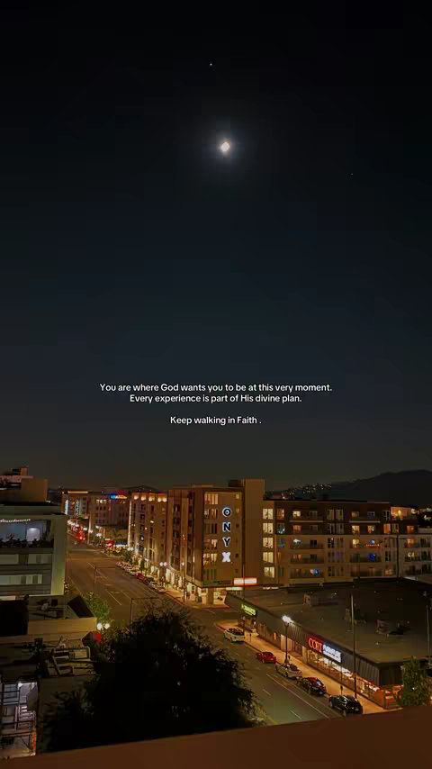 A night cityscape with a dark sky, a bright full moon and a few bright stars. The city is lit with many lights, and some text is overlayed on it. Buildings are in the foreground.