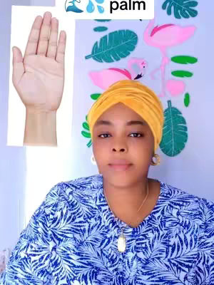The cover image features a woman centered in a selfie. She is wearing a bright yellow headscarf and a patterned blue and white top, the background is a pale wall decorated with pink flamingo silhouettes and green leaf shapes with the image of a hand on the top of the view. An image of a palm is located on the top left. The woman is looking at the camera.