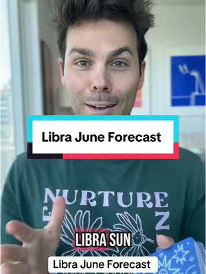 A man with brown hair and eyes, wearing a green t-shirt, points his left hand forward while holding and slightly showing a deck of cards. The background has a window and curtain on the right side with some drawing on it. The video has text overlay.