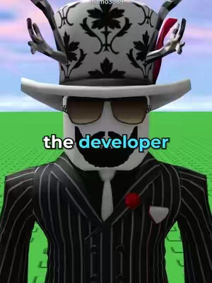 The image is a digitally created scene featuring a Roblox-like character. The character is a blocky figure with a white face, black mustache, and sunglasses. It's wearing a suit-like outfit with a white collar. The text 'the developer' is overlaid in a bold, sans-serif font, highlighting the subject's role.
