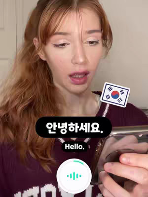 A young woman with long, reddish-brown hair partially pulled back, is looking at the camera, holding a phone that shows Korean characters, with a Korean flag sticker on her shirt. Text overlays highlight the Korean characters and their English translation, as well as an animated sound wave graphic below the phone.