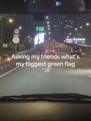 A nighttime shot taken from a car, looking out through the windshield onto a multilane highway with traffic. The road is lit by streetlights and the headlights of other cars. A text overlay on the image asks a question.