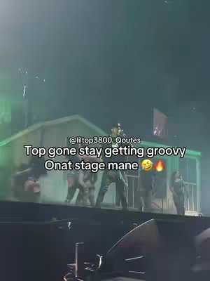 The cover image captures a scene from a concert. In the foreground, the stage and some of its mechanics are visible. In the background, several people are singing. The lighting seems to have touches of green and the text in the foreground is in white font.