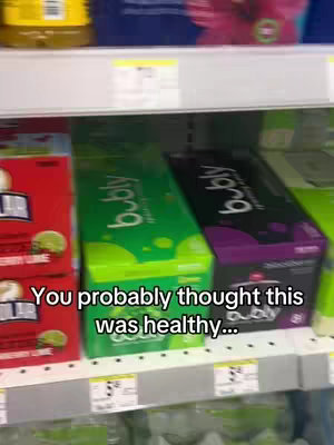 A shelf in a store is filled with boxes of Bubly sparkling water. The boxes are arranged in rows. The text overlay on the image says 'You probably thought this was healthy...'