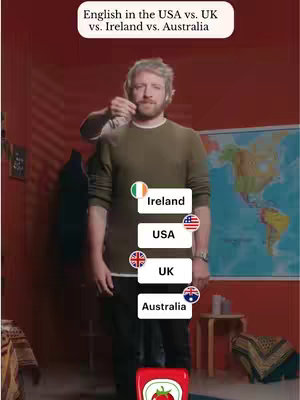 A man stands in front of a red wall with a world map and various graphics. The video is set up to compare English dialects.