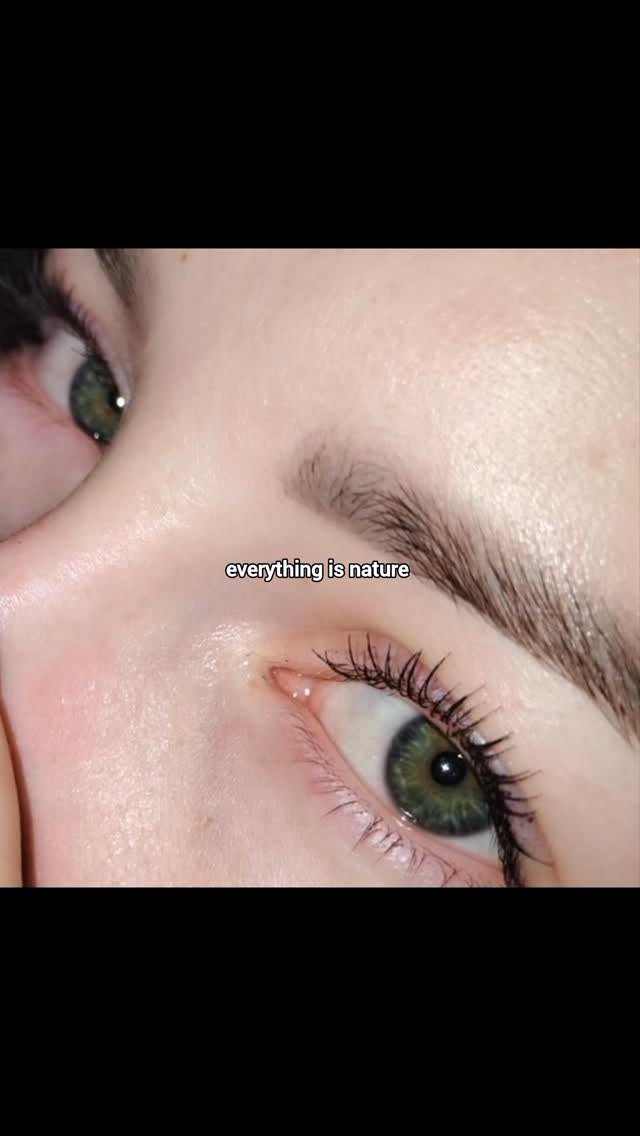 A close-up shot of a person's eye with the text overlayed. The iris is green, and the eye is the focal point against a soft, pale skin tone background.