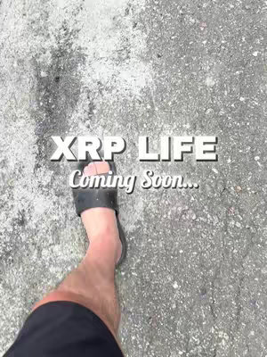 An image showcasing foot and lower-leg walking on a grey, textured surface. The text overlay reads "XRP LIFE Coming Soon..." in white.