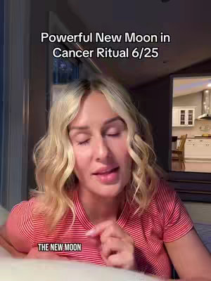 The image features a woman with long blonde hair and a red and white striped shirt. She is facing the camera, with a warm expression, presumably talking. Above her is the text overlay about a New Moon ritual. The background appears blurred but shows a well-lit kitchen, giving a sense of a home setting.