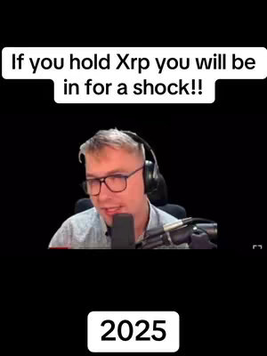 The cover image shows a man with glasses and a headset speaking into a microphone, set against a black background. Above him, a white banner displays the text 'If you hold Xrp you will be in for a shock!!'. Below the man, in a white rounded-rectangle box, is the number '2025'.