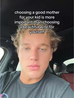 A selfie-style video cover image shows a young man in the driver's seat of a car looking at the camera. He has light skin, blond, slightly tousled hair, and appears to be in his 20s or 30s. The text at the top provides a message about choosing a good mother. The overall scene is somewhat dark, but the man's face is well-lit, drawing focus.