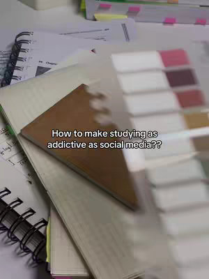 The cover image shows an overhead view of a desk setup with various study materials. The foreground is dominated by a stack of notebooks and a brown, leather-bound journal. The pages are open, showing written notes and annotations. To the right, partially out of focus, is a color palette or guide, adding a visual element. The background features additional books and papers. The image has a warm, inviting feel due to the lighting, possibly from natural light. Text overlayed on the central book asks a question related to study habits, drawing the viewer in.
