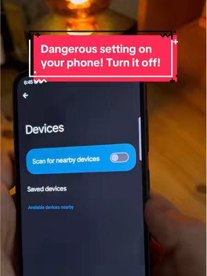 The cover image shows a smartphone screen displaying the 'Devices' settings in Android. A red-and-white text overlay at the top reads, 'Dangerous setting on your phone! Turn it off!' The focus is on the toggle switch for 'Scan for nearby devices,' which is highlighted, suggesting the video's content.