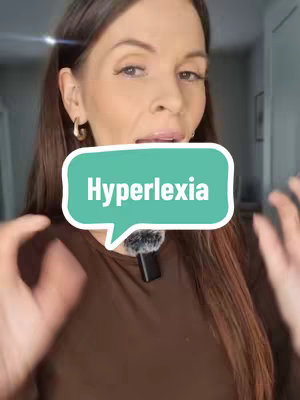 A woman with brown hair appears to be speaking. She's framed from the chest up, with a microphone clipped to her shirt. A speech bubble graphic overlays her, displaying the word 'Hyperlexia.'