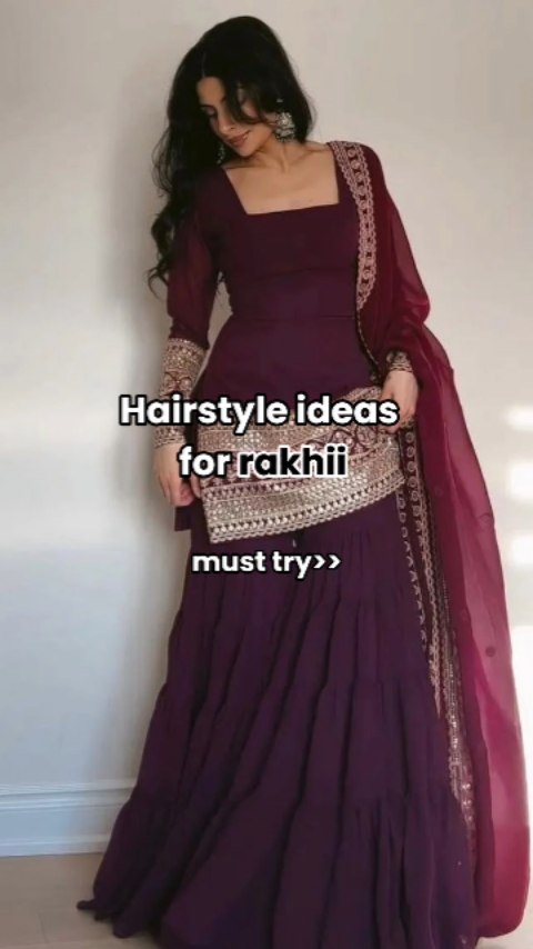 A woman wearing a dark purple suit is standing in front of a light-colored wall. Text overlay reads "Hairstyle ideas for rakhii must try girls" in white letters.
