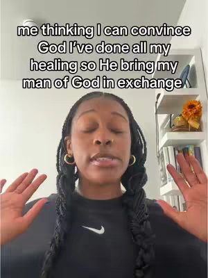 A woman with dark braids and gold hoop earrings looks directly at the camera with raised hands. Text over her head reads, "me thinking I can convince God I've done all my healing so He bring my man of God in exchange."