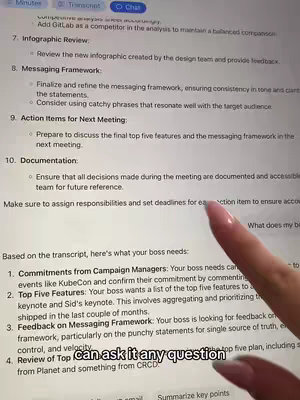A person's hand, with long pink nails, is pointing to a computer screen displaying a document with bullet points.